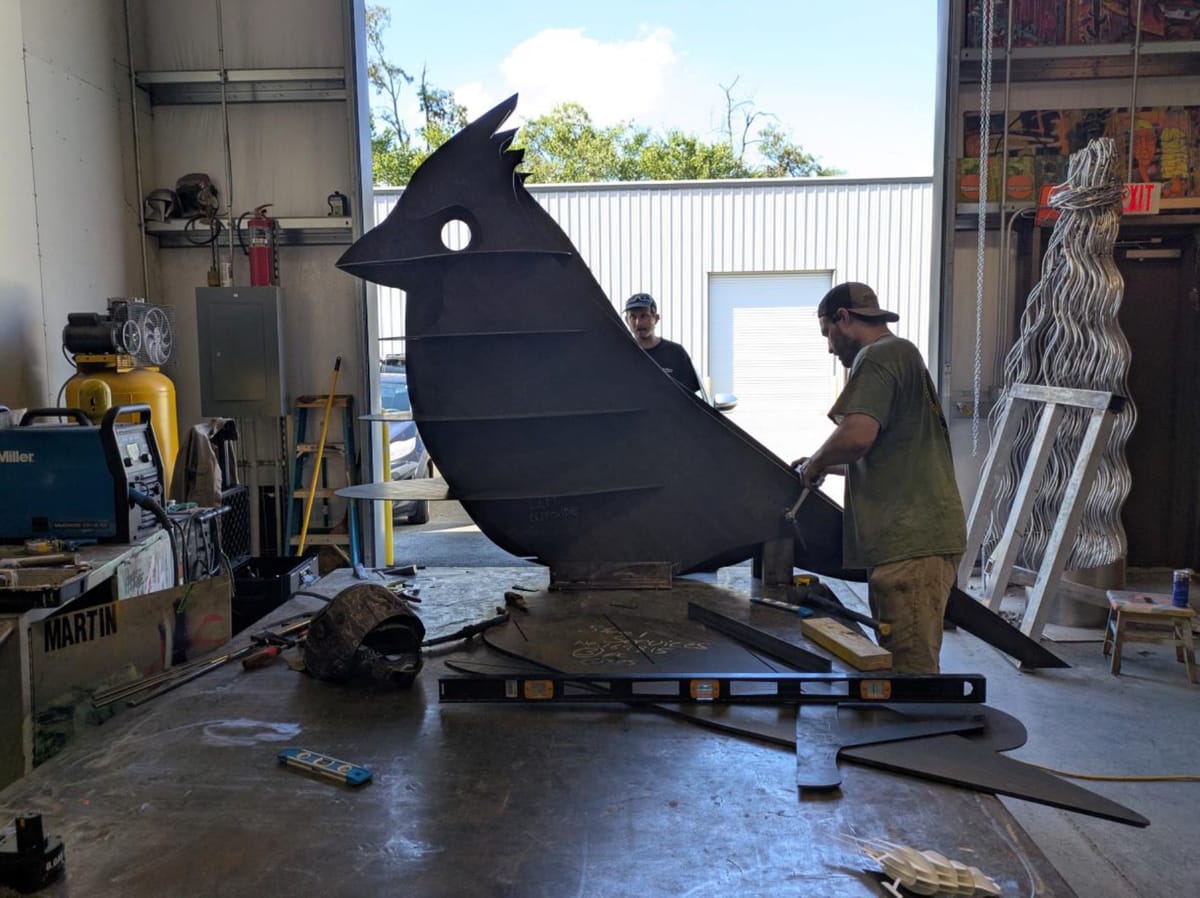 A giant cardinal sculpture is headed for a dead-end street near Lamplighter
